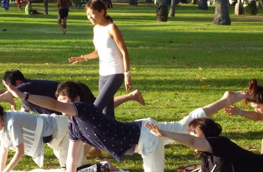 Hawaii yoga with tropical sunset at Waikiki Beach Park Hawaii yoga with tropical sunset at Waikiki Beach Park