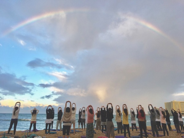 Masumi Muramatsu teaching outdoor yoga at Waikiki Beach, Hawaii